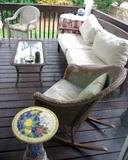 Solid teak patio sofa; turn of the century wicker rocker