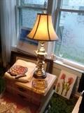 Brass lamp in Asian style on end table. 