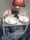 Wicker end table with vintage German porcelain bowls.