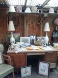 Garage shop filled with retro lamps, Wood chair is from the Carnation dairy.