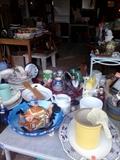 Various household items, platters, dishes, cups and steins.