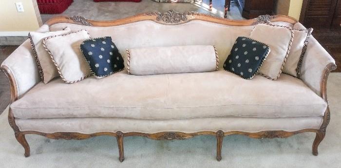 French provincial sofa with decorative pillows