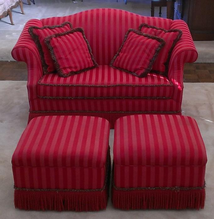 Red-on-red camel back love seat and ottomans