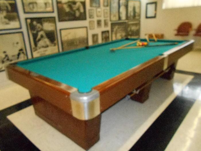 Pool table by Conn Billiard & Bowling Supply Company, with all accessories
