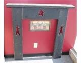 Cute painted black wood artificial fireplace mantle display with a Home Sweet Home hanging wall art