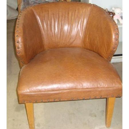 Nice vintage leather-like chair with wood legs and finishing brads