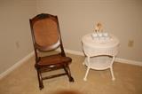 Cane Rocker and white Wicker table