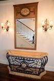Lot 1230A:  FRENCH STYLE CARVED GILT WOOD TRUMEAU MIRROR: Crest with applied cast plaque featuring cherubs, applied carved floral garland decoration. 49'' x 32 1/4'' beveled glass mirror, frame overall 75'' h. x 41 1/2'' x 1 3/4''. Est. $300/500**
CONDITION: Missing gilt trim decoration, spotting to mirror & Lot 1231:  DECORATIVE WROUGHT IRON FOYER TABLE: Contemporary foyer table, composite faux wood top and base, heavy wrought iron body with composite medallion, overall 33'' h. x 73 1/2'' x 19 1/2''.