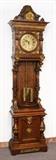 Lot 1003: GERMAN CARVED & ORMOLU MOUNTED TALL CASE CLOCK: Late 19th to early 20th century, profusely carved oak case with applied ormolu decoration to include masquerons, trim, foliate and floral decoration. Brass dial with Roman numerals, L. Furtwangler & Sohne time and strike movement, double weight, pierced and embossed pendulum. 90 1/4'' h. x 22 3/4'' x 13''.
CONDITION: Repair to trim on top, age splits to bezel, pendulum will require new suspension spring. currently running however not guaranteed to continue or to keep accurate time. 