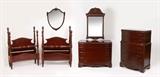 Lot 1054: 6 PIECE MAHOGANY BEDROOM SUITE: Mid 2th century, 6 pieces total to include 2 twin BEDS with carved spire finials (headboard 56'' h. x 41 1/4'' x 3 1/4'', foot board 51 1/2'' h.); 3. drawer over 3 full length drawer VANITY (36 1/2'' h. x 47 1/2'' x 22) with attached shield MIRROR on stand (37 1/2'' h. x 30''); Chippendale style wall MIRROR (48'' h. x 29''); 5 drawer tall CHEST (50 1/2'' h. x 36'' x 20'').
CONDITION: Wear consistent with everyday use, scratches to be expected. 