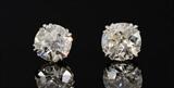 Lot 1087:  PLATINUM 4.92 CTW DIAMOND SOLITAIRE EARRINGS: Diamond stud earrings. 1) 2.52 Ct. Old mine cut diamond, 9.35 x 8.81 x 4.57 mm., VS2 clarity, Cape Light Yellow in color. 2) 1.95 Ct. Old European cut, 8.66 x 8.70 x 4.55 mm, VS1 clarity and also Cape Light Yellow color. Prong set, post and nut closure. Sold with current Atlanta Gemological GIA graduate's appraisal for $19,950. Est. $17000/19250**