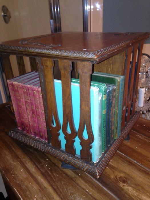 Early 1900's would of been used in a bookstore as a display case.
Hand Carved oak wood