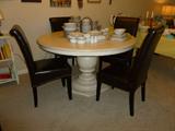 1 year old Paula Deen round pedestal dining table in linen

1 year old 4 leather banquet style chairs