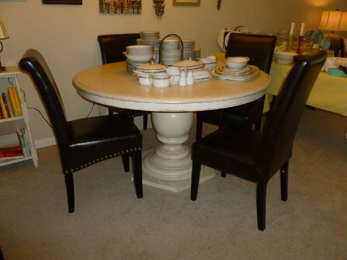 1 year old Paula Deen round pedestal dining table in linen

1 year old 4 leather banquet style chairs