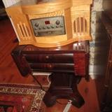 Empire mahogany drop leaf table with two front rounded drawers, graduated square and four curved C legs on wheels 29" high x 18" square each leaf 9" long