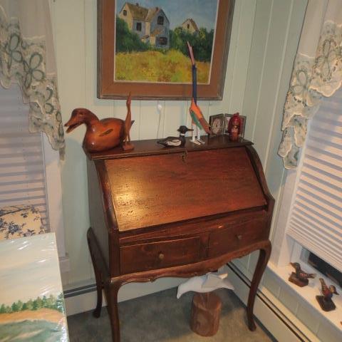 walnut Slant front desk over two drawers carved and curved apron, modified cabriole legs, distressed.