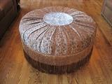 Large round ottoman.