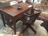 Early 1900s arts & crafts Craftsman oak desk with copper hardware; antique mahogany desk chair