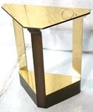 Lot 5:  CRESPI Style Brass Side Table. Triangular form top on 3 solid brass legs with tapered stepped supports. Small console table. Lower shelf.: Dimensions:  H: 28.25 inches: W: 23.5 inches: D: 12 inches --- 