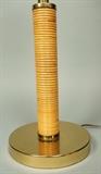 Lot 6:  CRESPI Style Rattan Wrapped Table Lamp. Brass & Rattan Cylinder form : Dimensions:  H: 25 inches: W: 8 inches --- 