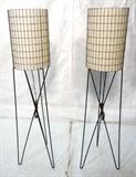 Lot 10:  Pr Tall 50's Modern Black Iron Hairpin Floor Lamps. PAUL MAYEN. Hairpin bases support cylindrical shade with textured paper lining.: Dimensions:  H: 57.75 inches: W: 12 inches: D: 12 inches --- 