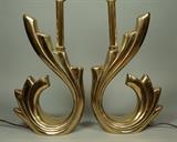 Lot 64:  Pr Modernist Brass Swirl Table Lamps. Shiny brass finish. Textured finish to tops. Not marked. : Dimensions:  H: 27 inches: W: 10 inches: D: 4 inches --- 