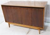 Lot 74:  Belgium Modernist Rosewood Sideboard Buffet. Two bifold doors with brass ring details. Eight interior drawers with cut out detailing. Contrasting  beveled trim frame. Seriously stylish! Marked: Dimensions:  H: 32.5 inches: W: 49.75 inches: D: 20 inches --- 