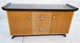 Lot 94:  PAUL FRANKL for BROWN SALTMAN Server Credenza. Banded wood design. Brass hardware. Two doors. Four drawers. Thick rolled edge dark wood top and feet. : Dimensions:  H: 33.5 inches: W: 66 inches: D: 20.5 inches --- 