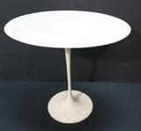 Lot 107:  EERO SAARINEN Tulip Oval Side Table. KNOLL. White laminate top. White enamel base. No marks: Dimensions:  H: 20.5 inches: W: 22.5 inches: D: 15 inches --- 