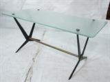 Lot 111:  Ostuni Italian Textured glass Top Coffee Table. Black Iron Corseted Legs with brass stretcher and end caps. : Dimensions:  H: 17.5 inches: W: 37.75 inches: D: 19 inches --- 