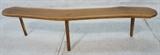 Lot 129:  Free Form Wood Slab Bench Table. Natural edges. Tapered legs. : Dimensions:  H: 17 inches: W: 72 inches: D: 12 inches --- 