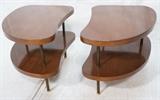 Lot 130:  Pr Two Tier American Modern Walnut Kidney shaped Side Tables. Dark metal column legs & supports.  : Dimensions:  H: 22 inches: W: 20 inches: D: 30 inches --- 