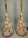 Lot 136:  Pr Decorator Glass Lamps. Dancing Harlequin Jester Design. Cone form frosted glass. Wood Trim Details. : Dimensions:  H: 48 inches: W: 13 inches --- 