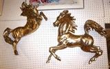 Lot 147:  Pr Metal Figural Horse Wall Sculptures. Deep 3D Horses with Flared Manes and expressive action poses. Unmarked.: Dimensions:  H: 27 inches: W: 28 inches: D: 10 inches --- 