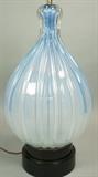 Lot 159:  Light Blue Art Glass Table Lamp. Ribbed Bulbous Form. Black ebonized wood base.: Dimensions:  H: 33 inches: W: 13 inches --- 