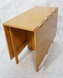 Lot 175:  Drop Side Dining Table George Nelson for Herman Miller. Blond Wood Modernist.     24" drops. Foil label 4656. : Dimensions:  H: 30 inches: W: 18 inches: D: 40 inches --- 