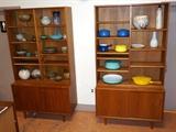 Lot 203:  Pr Danish Modern Teak Bookshelf Cabinets. Open adjustable shelves over two sliding door cabinet bases. Tapered legs. : Dimensions:  H: 79 inches: W: 42.5 inches: D: 17 inches --- 