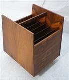 Lot 210:  BRUXBO Danish Rosewood Magazine Rack. Six interior compartments. Rolling form.  Label: Dimensions:  H: 17.75 inches: W: 13.5 inches: D: 16 inches --- 