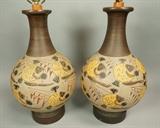 Lot 214:  Pr Large Pottery Table Lamps.  Graphic design of FISH with sails. : Dimensions:  H: 24 inches: W: 11.5 inches --- 
