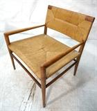 Lot 215:  ROBSJOHN GIBBINGS Style Arm Lounge Chair. Woven Seat & Back. American Modern Wood Frame. : Dimensions:  H: 28 inches: W: 24 inches: D: 23 inches --- 