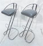 Lot 216:  Pr Modernist Chrome Bar Stools. Tubular Frames. Gray Seats. Not Marked: Dimensions:  H: 37 inches: W: 17.25 inches: D: 17 inches --- 
