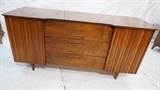 Lot 225:  American Modern Credenza Sideboard. Two Decorative Doors. Three Drawers. Metal bamboo pulls. Shaped front: Dimensions:  H: 30.75 inches: W: 62 inches: D: 20 inches --- 
