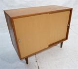 Lot 228:  Danish Modern Teak Server Credenza. Two Cloth covered doors. Peg legs. Aluminum ring pulls: Dimensions:  H: 30 inches: W: 36 inches: D: 18 inches --- 