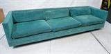 Lot 229:  Long HARVEY PROBBER Sofa Couch. Aqua Turquoise Fabric upholstery on long horizontal frame. Wood peg legs. Marked.: Dimensions:  H: 25 inches: W: 102 inches: D: 32 inches --- 