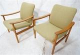 Lot 236:  Pr Danish Modern Teak Arm Lounge Chairs. Bowed arm rests. Pale green fabric.: Dimensions:  H: 30.25 inches: W: 27 inches: D: 25 inches --- 