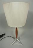 Lot 230:  ARTEMIDE Glass & Wood Table Lamp. Italian. Striped glass shade. Four aluminum feet. Original label.: Dimensions:  H: 20 inches: W: 11.25 inches --- 