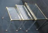 Lot 240:  Set 3 Lucite & Brass Nesting Tables. Inset beveled glass tops. Hollis Jones style. Brass frame & caps. Lucite column legs: Dimensions:  H: 18.5 inches: W: 23.5 inches: D: 15.75 inches --- 