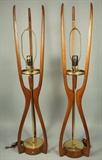 Lot 247:  Tall Pair American Modern Walnut & Brass Table Lamps. Three tall corseted arms with center brass rod and disc detail.  Neat detail where wood element on brass column activates on/off switch. : Dimensions:  H: 44.25 inches: W: 9 inches --- 