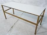 Lot 255:  Brass Frame White Milk Glass Coffee Table Low console. Square brass tube frame. Lower stretcher.  Probber Style.: Dimensions:  H: 22 inches: W: 48.25 inches: D: 18 inches --- 