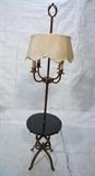 Lot 263:  Tommi Parzinger style Table Floor Lamp. Antiqued gilt iron 4 arm candle lamp. Decorative gilt iron base and finial. Black marble round table top. Not marked. : Dimensions:  H: 73 inches: W: 17.5 inches --- 